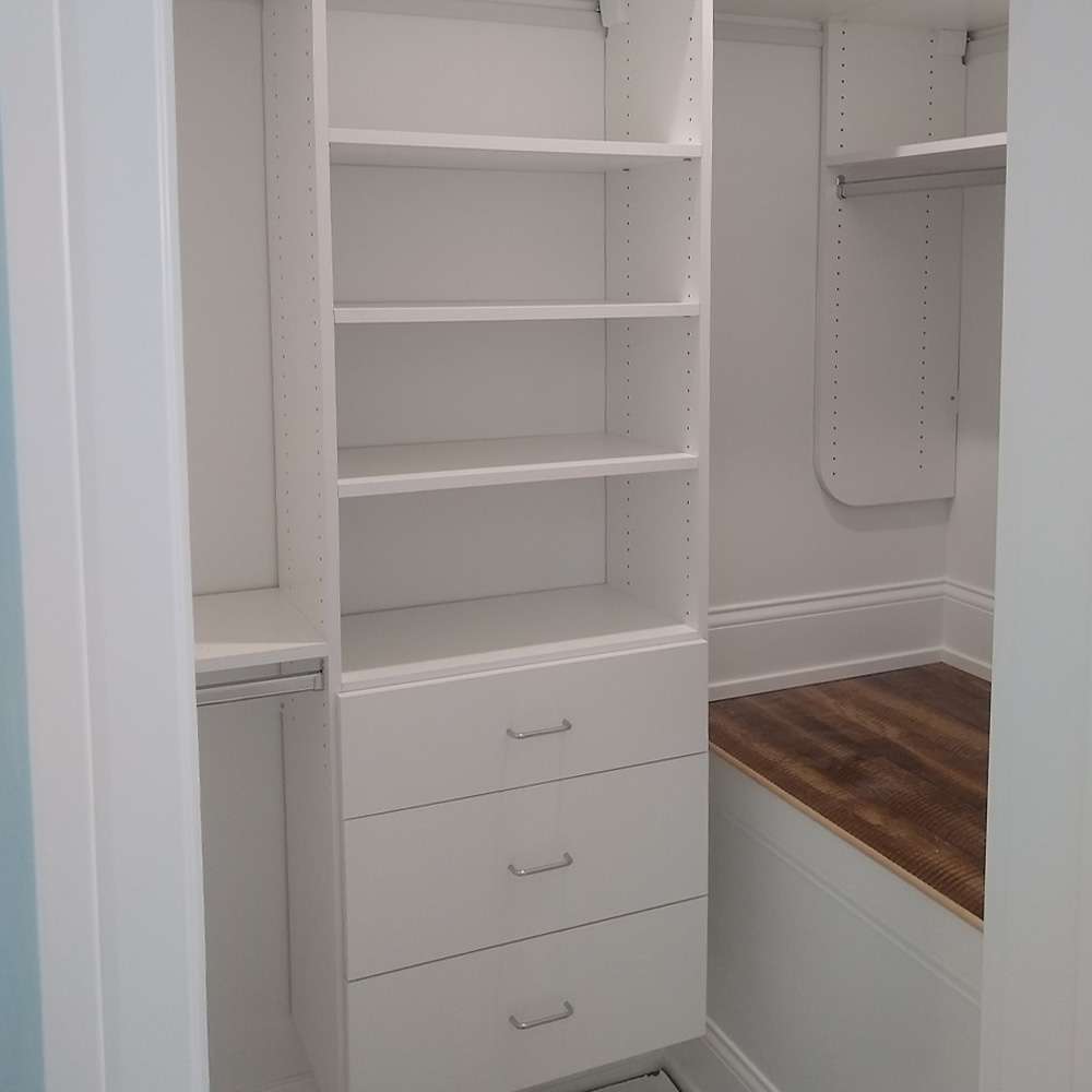 White melamine with Flat fronts, standard chrome handles, and suspended closet